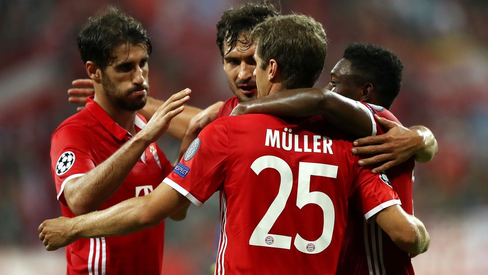 MUNICH, GERMANY - SEPTEMBER 13:  Thomas Mueller of Bayern Muenchen celebrates scoring his sides second goal with team mates during the UEFA Champions League Group D match between FC Bayern Muenchen and FC Rostov at Allianz Arena on September 13, 2016 in Munich, Germany.  (Photo by Alexander Hassenstein/Bongarts/Getty Images)